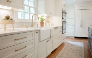 Kitchen Remodel in Brentwood Tennessee House with white cabinets, quartz countertop, gold hardware, apron sink